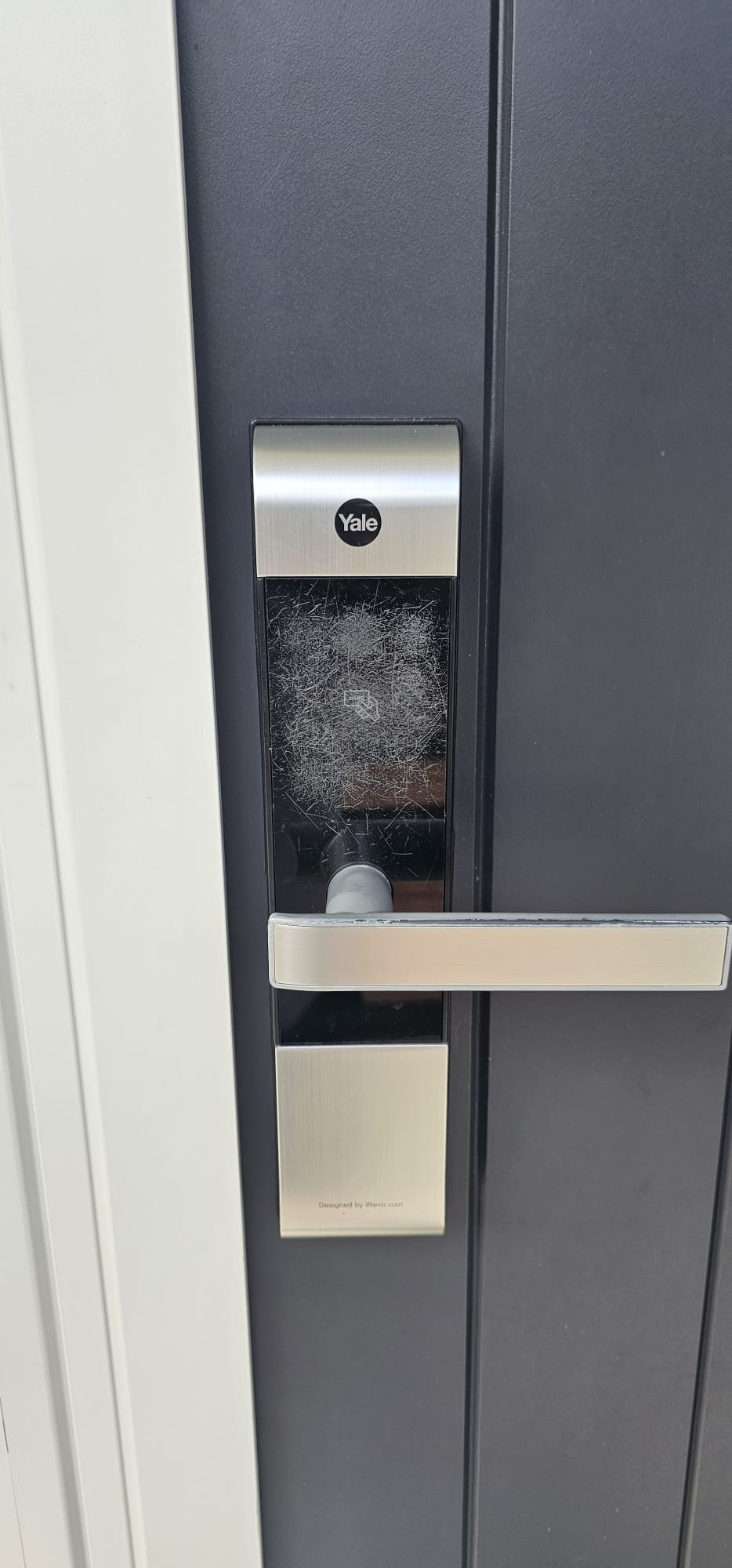 Damaged scratched Yale keypad before restoration